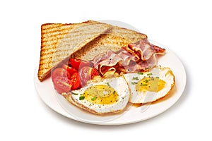 Plate with eggs, bacon, tomatoes and toast isolated on white background