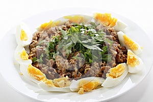 Plate of Egyptian foul with eggs photo
