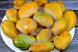 Plate of Egyptian fresh mango fruit with tropical delicacy, mangoes are nutritionally rich fruit with distinctive flavor, smell,