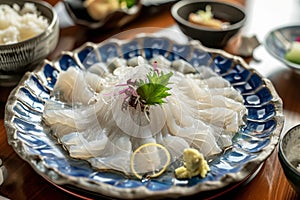 A plate filled with a delectable spread of food placed on a wooden table