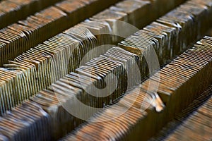 Plate-fin heat exchanger surface closeup diagonal texture. Old heat exchange equipment bent damaged plates with traces