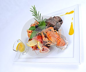 Plate of fine dining meal beef with lobster