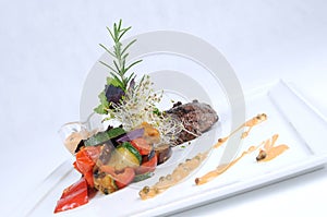 Plate of fine dining meal tender ostrich fillet