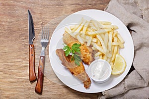 Plate of fish and chips, top view