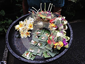 Plate with floral offerings, Bali photo