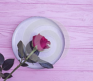 Plate flower rose  wooden backgroundn rustic photo