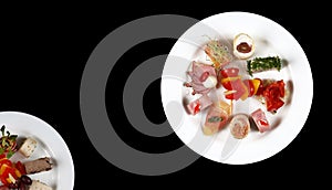 Plate with food on a black background