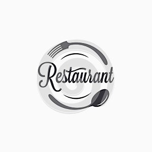 Plate with fork and spoon. Restaurant logo photo