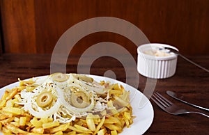 Plate of French Fries with Coleslaw and Olives