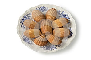 Plate with fresh baked French madeleines