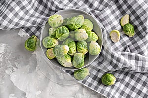 Plate with fresh brussels sprouts on table, top view