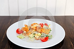 Plate with fresh caesar salad with chicken