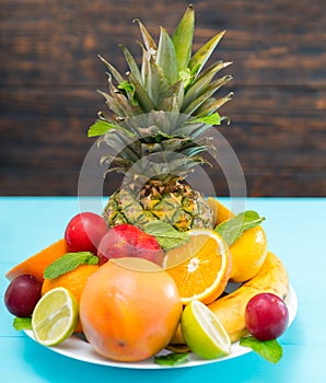 Plate of fresh healthy tropical fruit for dessert