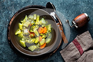 plate of fresh hot vegetable soup with broccoli