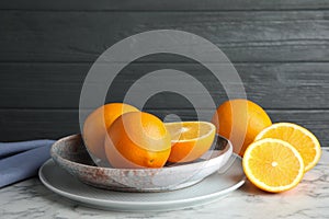 Plate with fresh juicy oranges