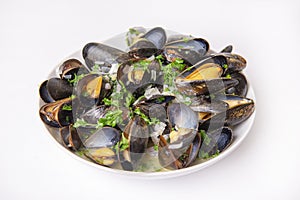 Plate of fresh mussels with onion and parsley mignonette