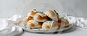 a plate of freshly made cheese bread rolls