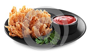 Plate with fried blooming onion and sauce isolated on white