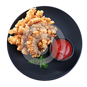 Plate with fried blooming onion and sauce isolated on white, top view
