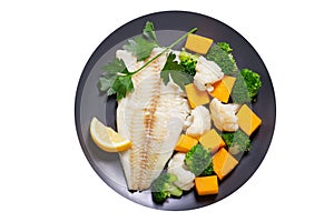 plate of fried cod fish fillet with vegetables isolated on white background