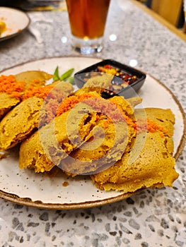 A plate of fried crispy tempeh