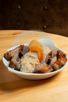 A plate of fried pork with Alentejo-style migas.