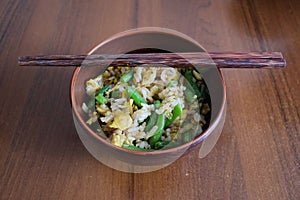 Plate with fried rice with egg and green beans