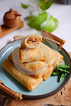 A plate of fried spring roll with vegetable and vermicelli on the table
