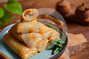 A plate of fried spring roll with vegetable and vermicelli on the table