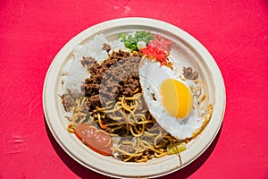 Plate of fry noodles, meat and sunny egg