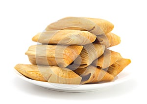 Homemade Wrapped Tamales on a Plate photo