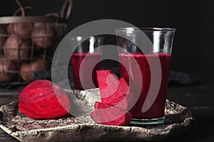 Plate with glass of beet smoothie