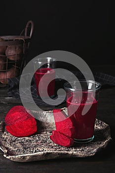 Plate with glass of beet smoothie