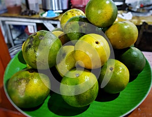 A plate of green sweet oranges squash or jeruk peras photo