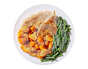 Plate of grilled turkey chops, baked potatoes and green beans isolated on white background