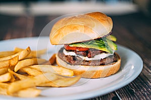 A plate of hamburger and fries