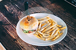 A plate of hamburger and fries