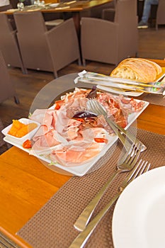 Plate of hams and smoked sausages