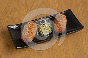 Plate of homemade ham croquettes, typical Spanish dish