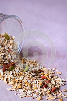 Plate of homemade muesli with cornflakes, Goji berries, chia seeds, freezedried apricot, sunflower seeds, cinnamon.