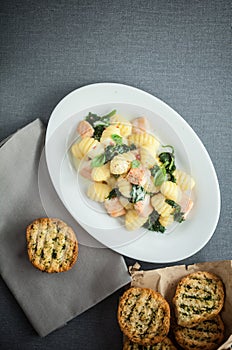 Plate of Italian gnocchi pasta and salmon