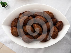 A plate with kibbe, a famous arabic food photo