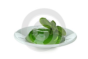 Plate with kiwi jelly isolated on white background