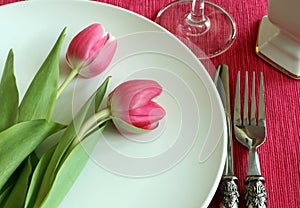 Plate, knife, fork and tulips