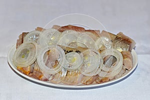 Plate with herring and onions photo