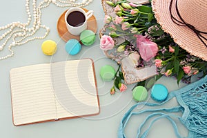 plate of macaroons over wooden table cofee, emprty table and flo