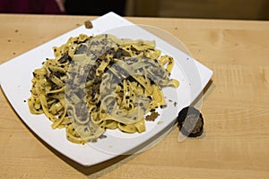 Plate with made spaghetti with cheese and black truffle