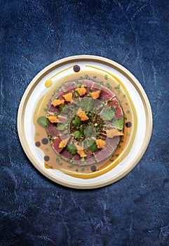 A plate of Marinated Tuna steak sliced.