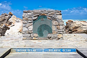The plate marking the point of Cape Agulhas, the southernmost point of africa. The indian ocean is on the right, the Atlantic