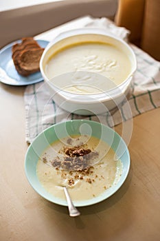 Plate of mashed potato soup with bread